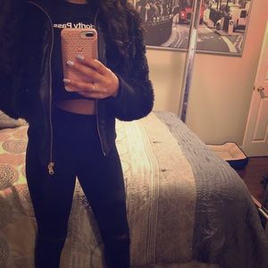 Black faux fur coat w/ vegan leather trim detail.